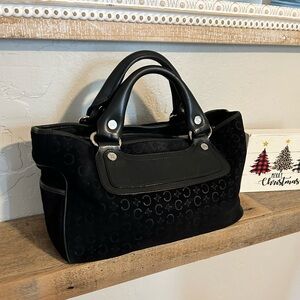 Vintage Celine y2k black suede Boogie bag with a repeating embossed 'C' motif.